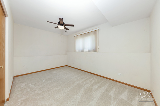 701 Bishops Gate New Lenox, IL 60451 - Photo 17 of 27 an empty room with windows and fan