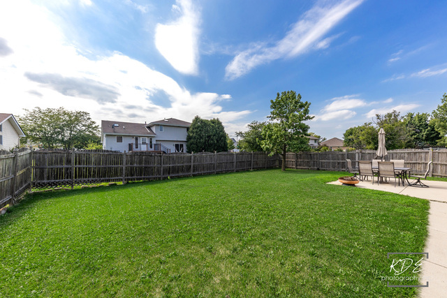 701 Bishops Gate New Lenox, IL 60451 - Photo 25 of 27 a view of a backyard with swimming pool