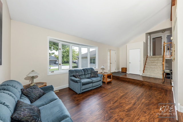 701 Bishops Gate New Lenox, IL 60451 - Photo 3 of 27 a living room with furniture and a large window
