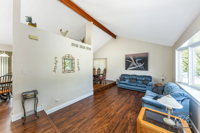 701 Bishops Gate New Lenox, IL 60451 - Photo 4 of 27 a living room with furniture and a wooden floor