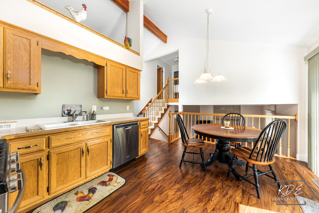 701 Bishops Gate New Lenox, IL 60451 - Photo 9 of 27 a view of a kitchen with a table and chairs