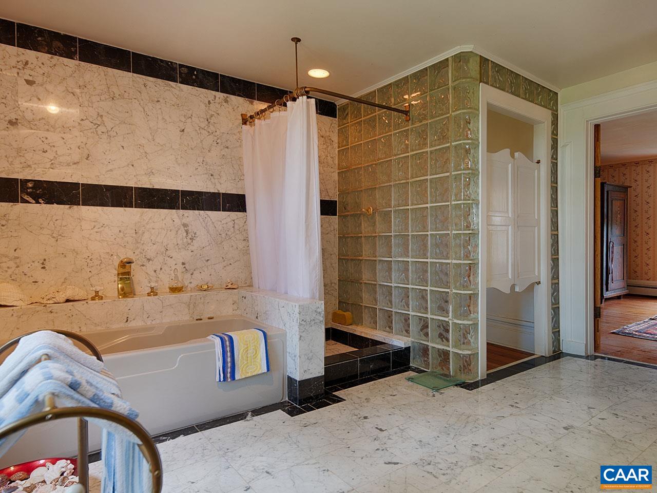 1825 Locust Grove Church Road Orange, VA 22960 - Photo 17 of 68 a bathroom with a bathtub and a shower