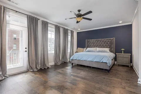 a bedroom with furniture and a window