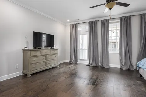 a bedroom with a bed and chair