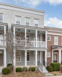a front view of a house with a large window