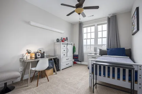 an aerial view of a house with a swimming pool