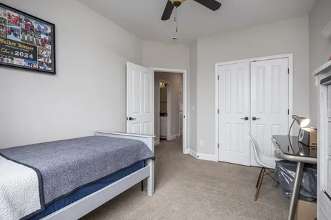 a view of a house with a big yard and a wooden deck