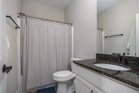 a view of a house with a yard and a garden