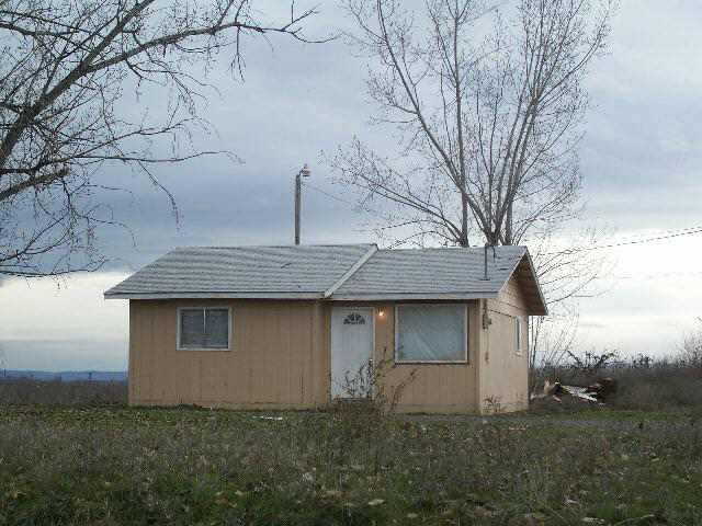 1920 Division Road Zillah, WA 98953 - Photo 1 of 1 a front view of a house with a yard