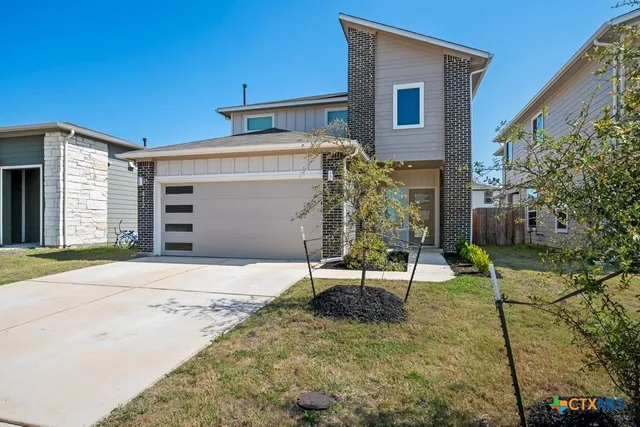 a house with garden in front of it
