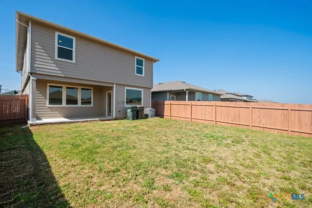a bathroom with a sink and a yard