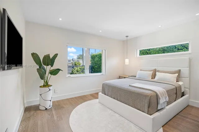 a bedroom with a bed and tv