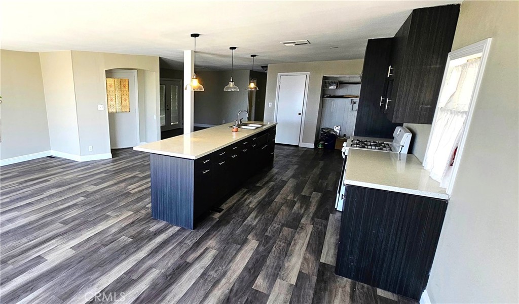 9800 Base Line Road, Unit 82 Alta Loma, CA 91701 - Photo 17 of 28 a kitchen with stainless steel appliances granite countertop a sink stove and refrigerator