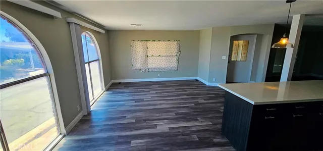 a view of a hallway view with wooden floor and staircase