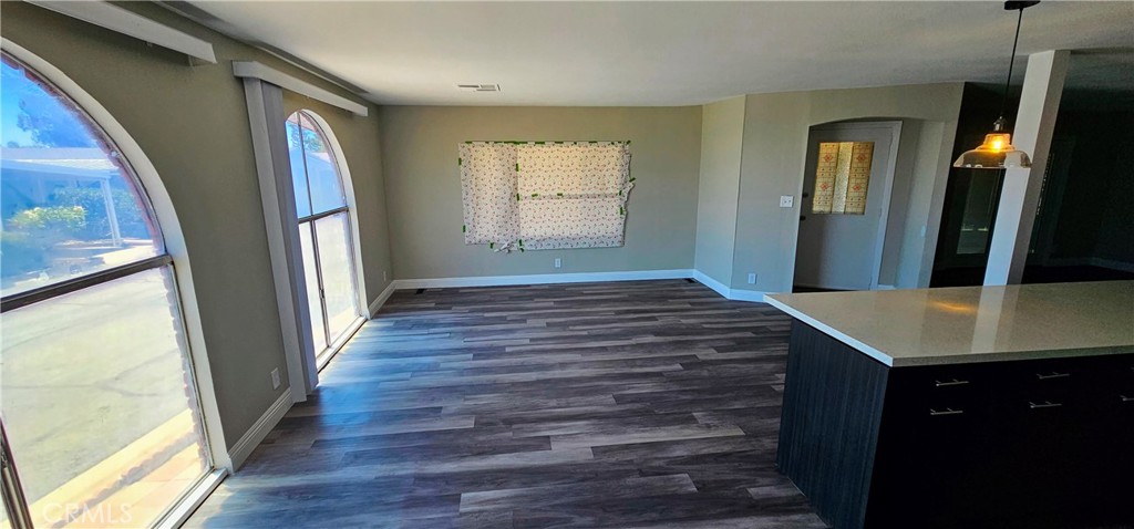 9800 Base Line Road, Unit 82 Alta Loma, CA 91701 - Photo 18 of 28 a view of a hallway view with wooden floor and staircase