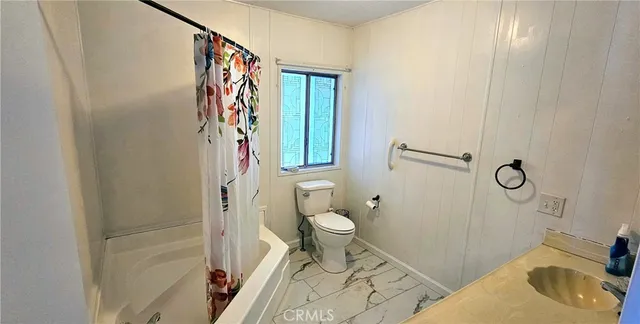 a bathroom with a sink and toilet