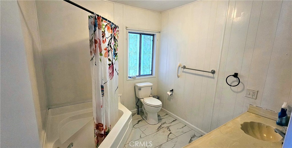 9800 Base Line Road, Unit 82 Alta Loma, CA 91701 - Photo 20 of 28 a bathroom with a sink and toilet