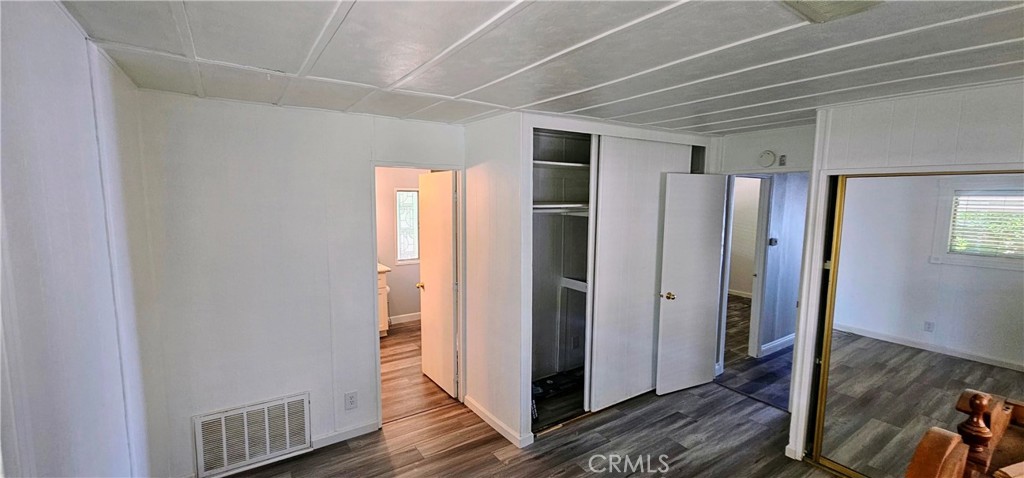 9800 Base Line Road, Unit 82 Alta Loma, CA 91701 - Photo 25 of 28 a view of hallway with wooden floor