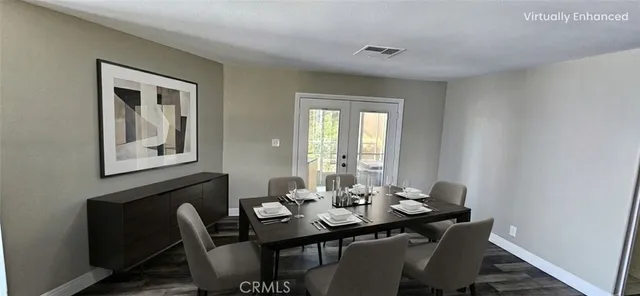 a view of a dining room with furniture and window