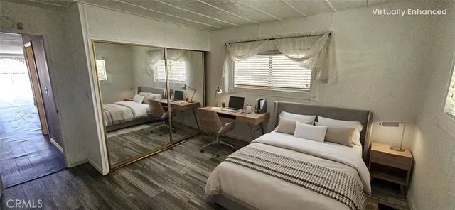 a bed room with a bed and a window