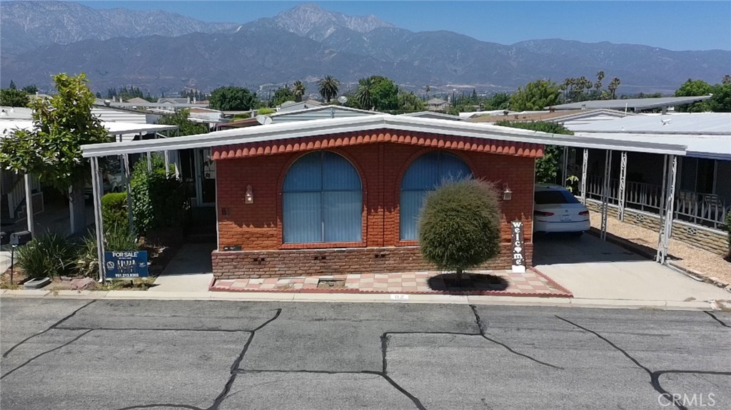 9800 Base Line Road, Unit 82 Alta Loma, CA 91701 - Photo 10 of 28 a view of a street with a barn in front of it