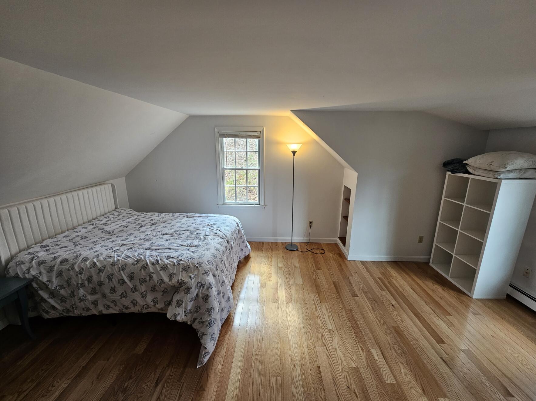 3098 State Highway Wellfleet, MA 02667 - Photo 13 of 13 a bedroom with a bed and wooden floor