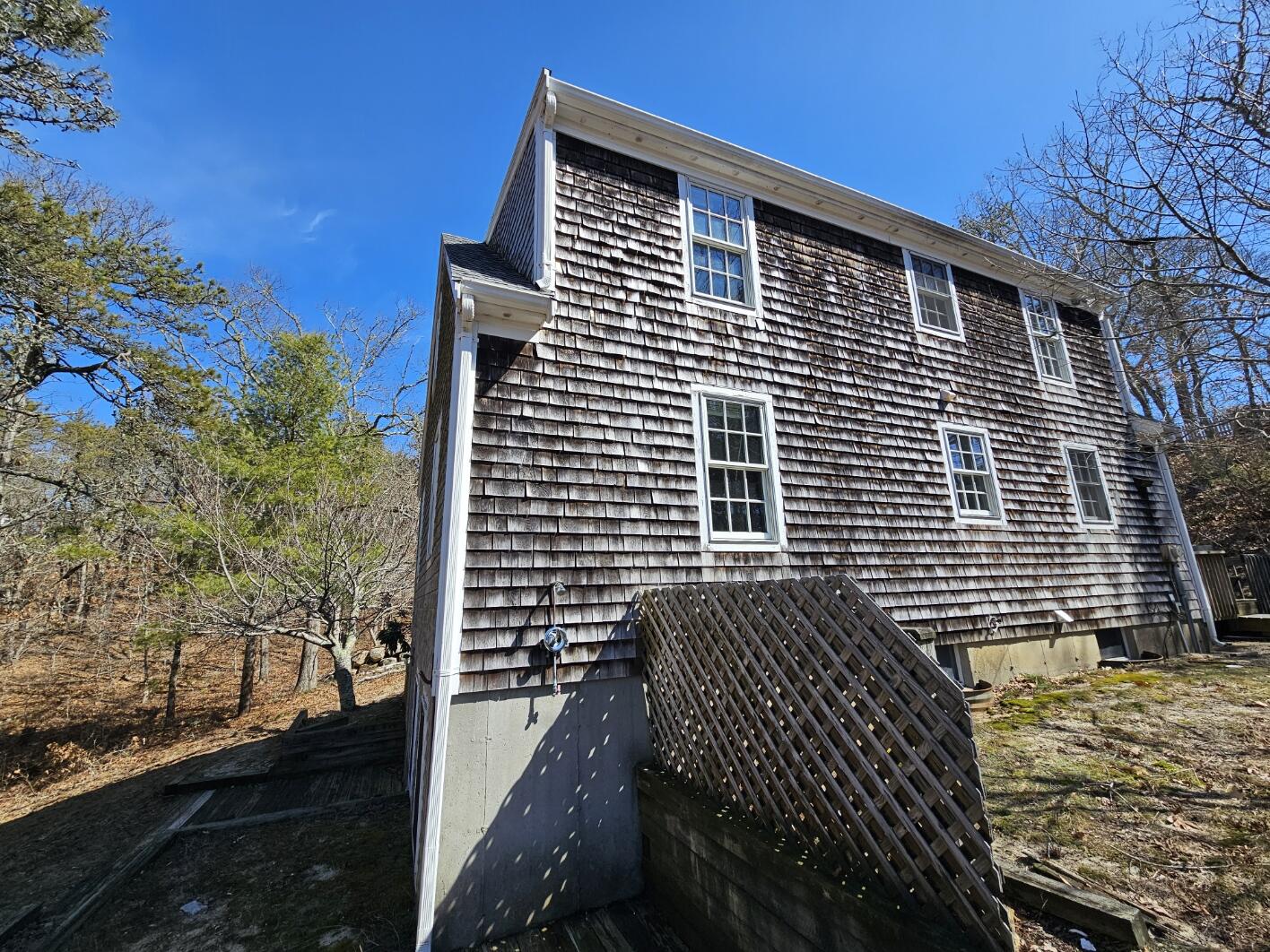 3098 State Highway Wellfleet, MA 02667 - Photo 3 of 13 a front view of a house with trees