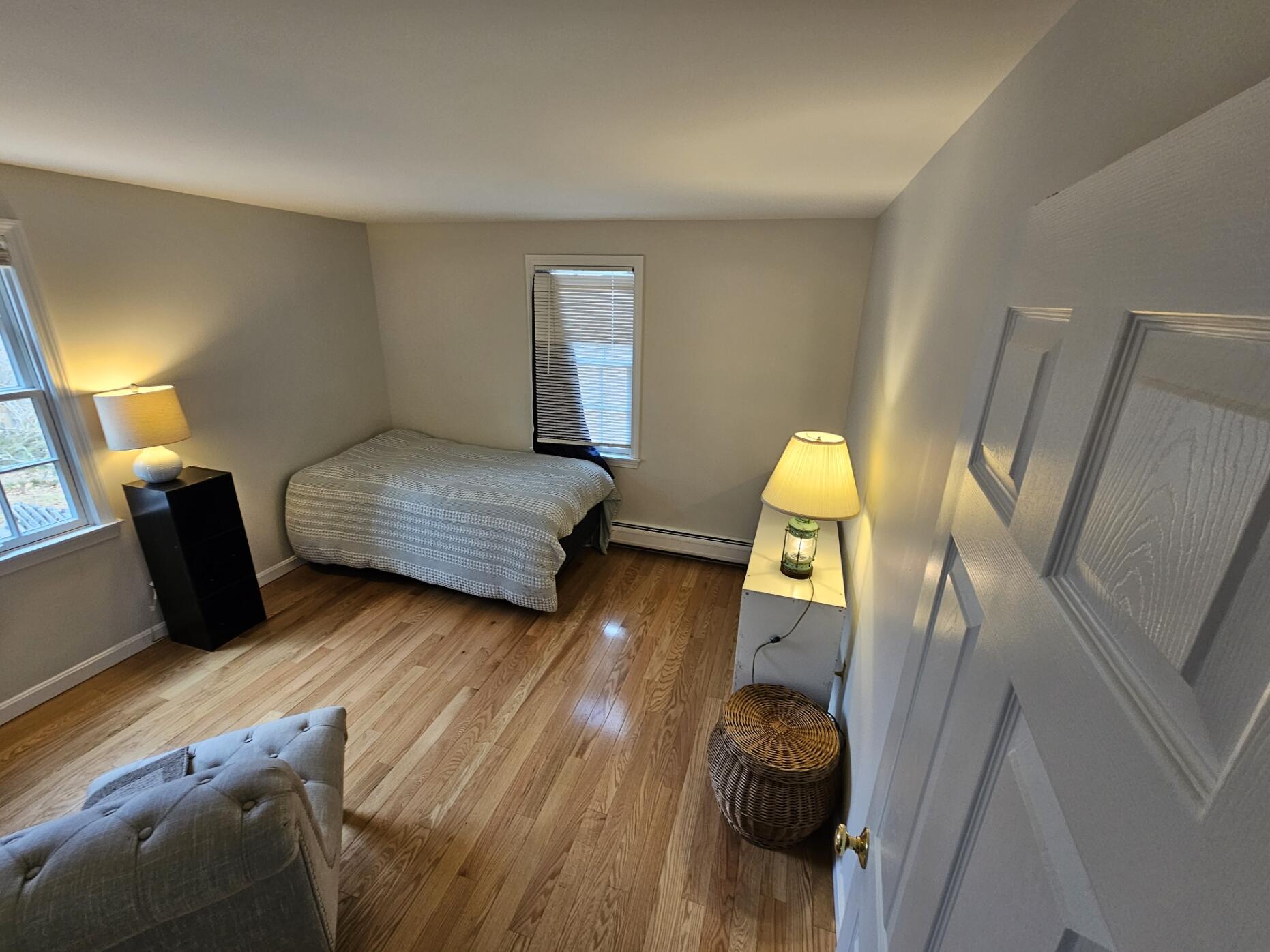 3098 State Highway Wellfleet, MA 02667 - Photo 5 of 13 a bedroom with wooden floor and furniture