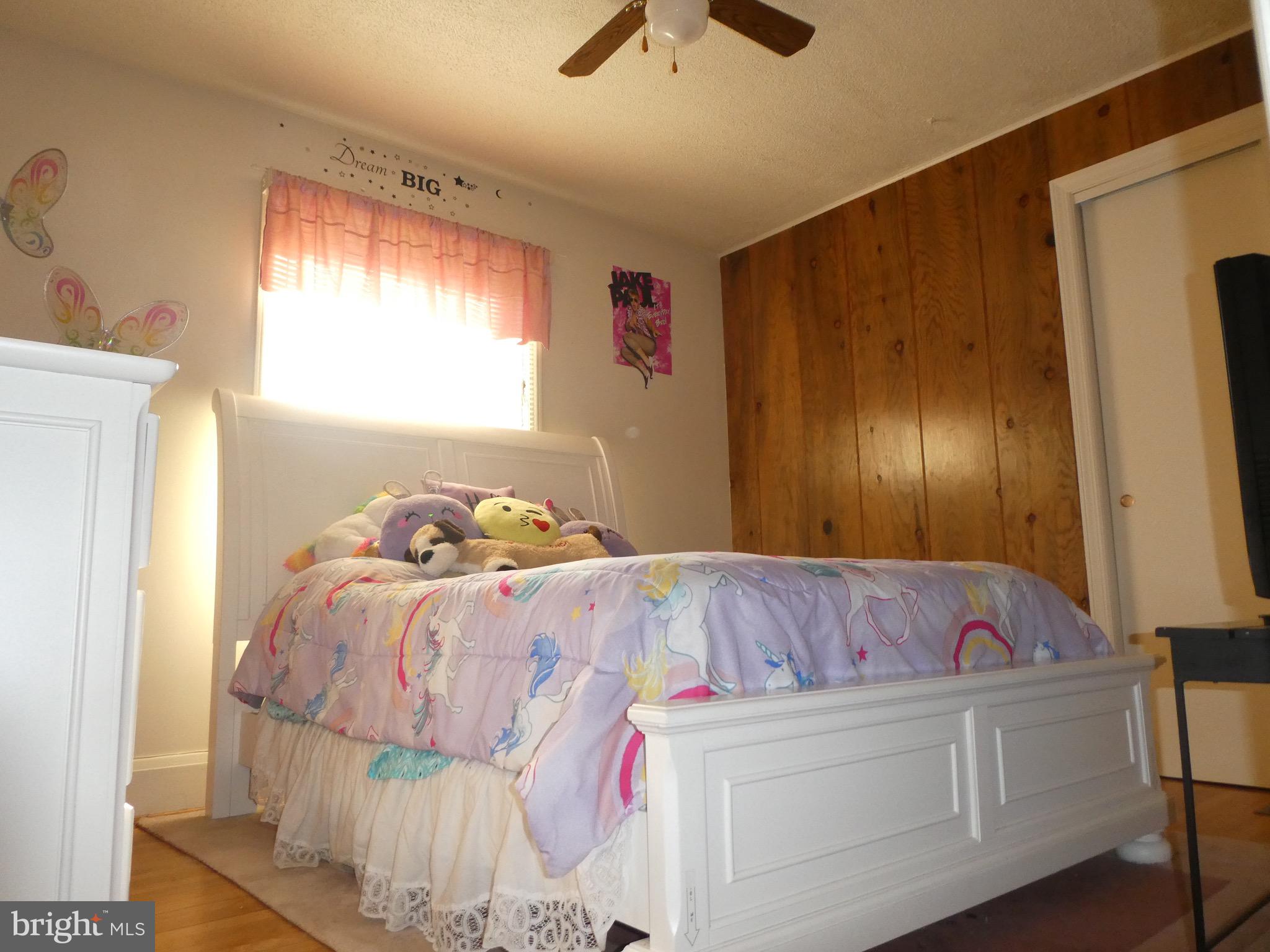 4024 Essex Road Baltimore, MD 21207 - Photo 18 of 44 3rd Bedroom with Ceiling Fan and H/W Floors