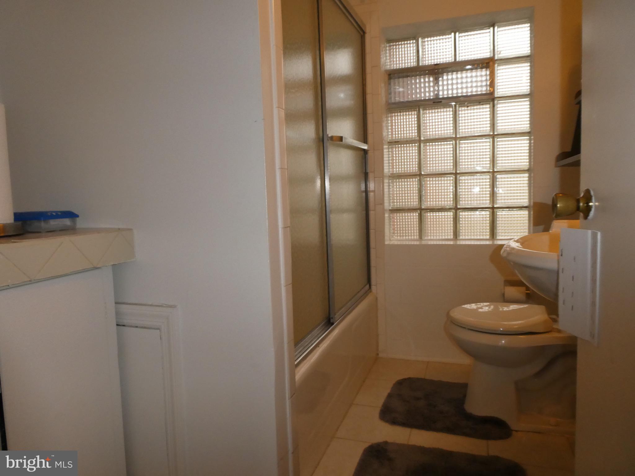 4024 Essex Road Baltimore, MD 21207 - Photo 19 of 44 2nd Full Bath with Storage Cabinets