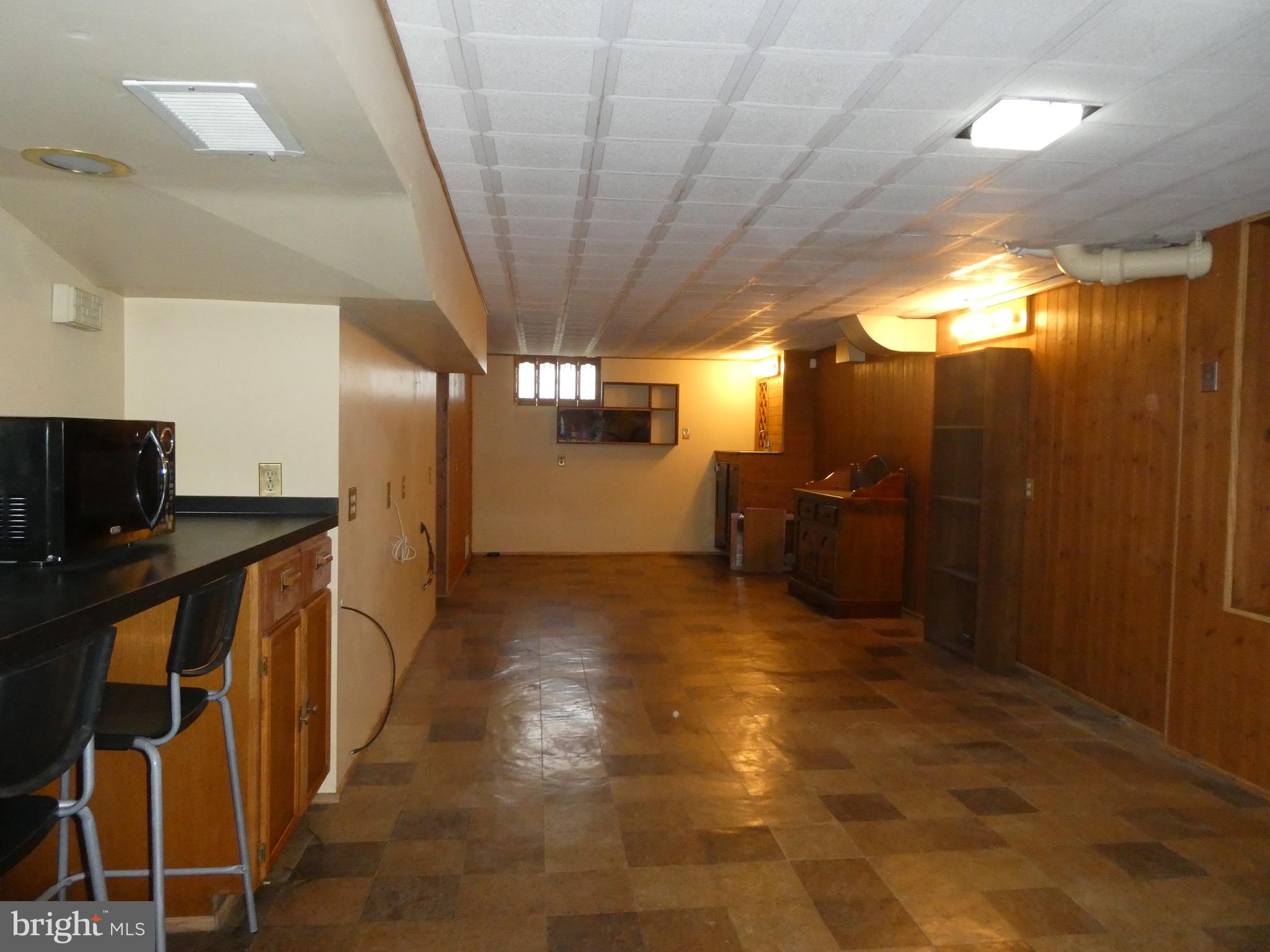 4024 Essex Road Baltimore, MD 21207 - Photo 33 of 44 Family Room with Wet Bar has room for fun & games