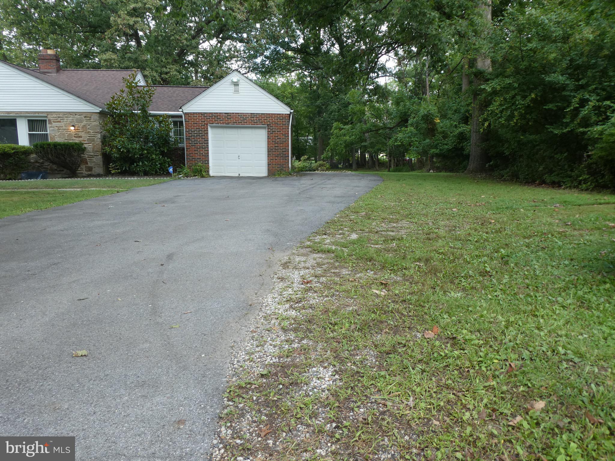 4024 Essex Road Baltimore, MD 21207 - Photo 41 of 44 Paved driveway extends to back of garage