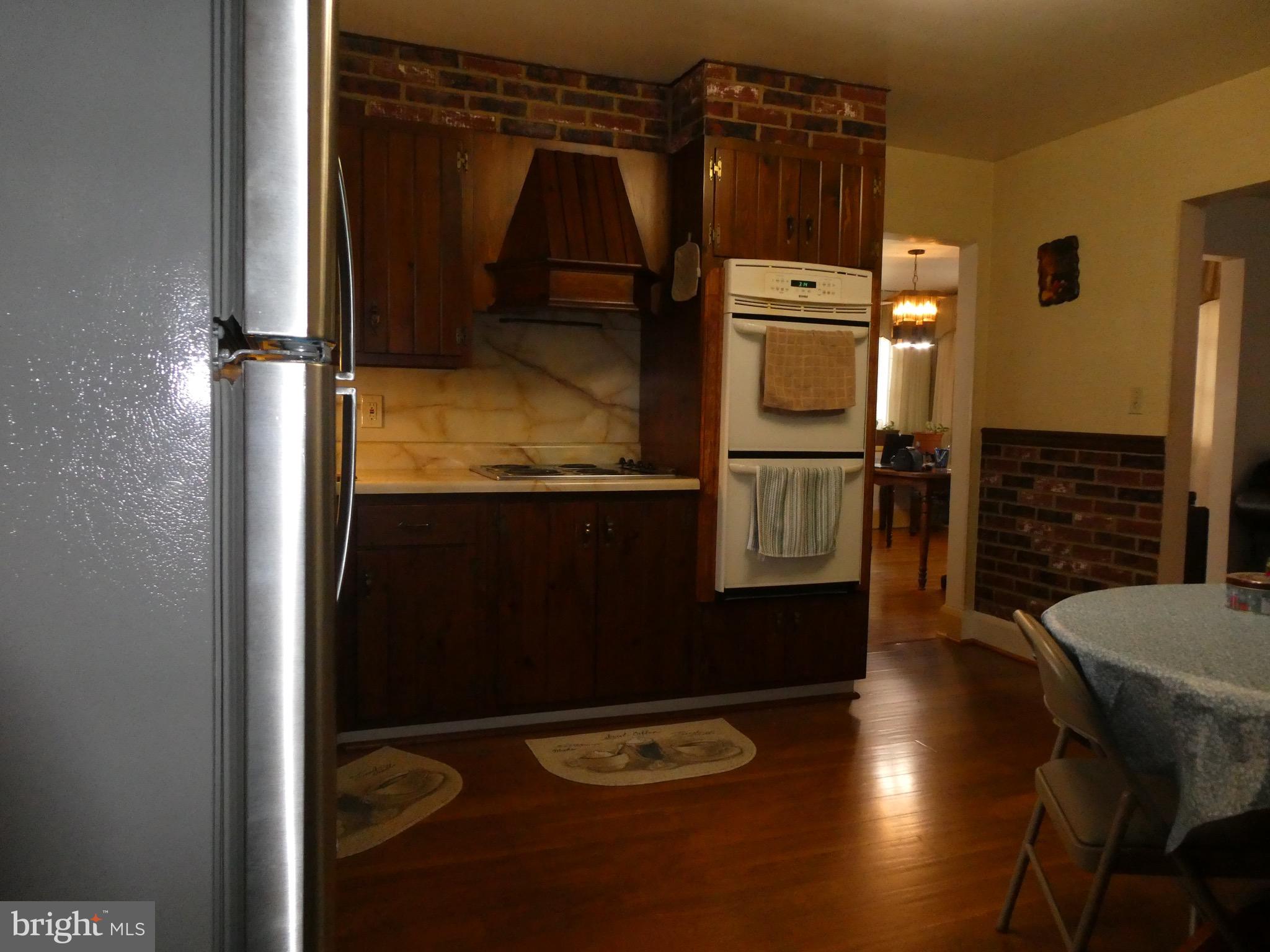 4024 Essex Road Baltimore, MD 21207 - Photo 10 of 44 Kitchen Table & food prep space; view near porch