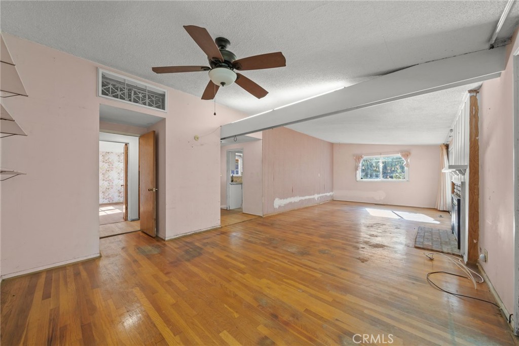 27151 Pembina Road Rancho Palos Verdes, CA 90275 - Photo 11 of 33 a view of a big room with wooden floor a ceiling fan and windows