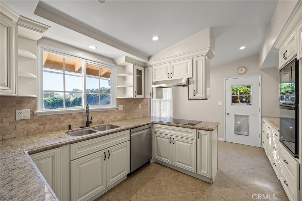 27151 Pembina Road Rancho Palos Verdes, CA 90275 - Photo 12 of 33 a kitchen with a sink stove and cabinets
