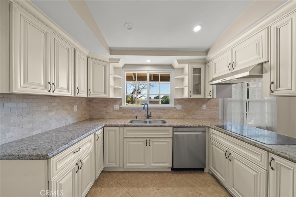 27151 Pembina Road Rancho Palos Verdes, CA 90275 - Photo 13 of 33 a kitchen with a sink stove and cabinets