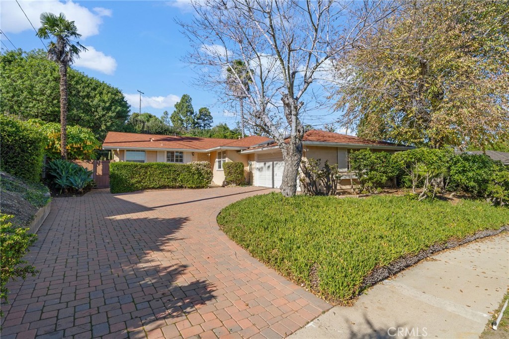 27151 Pembina Road Rancho Palos Verdes, CA 90275 - Photo 2 of 33 a front view of a house with a yard