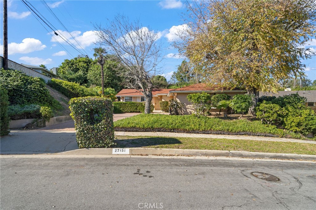 27151 Pembina Road Rancho Palos Verdes, CA 90275 - Photo 3 of 33 a front view of a house with a yard