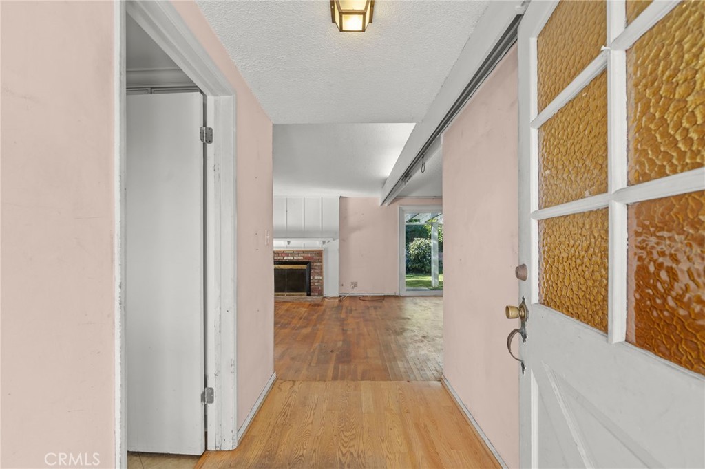 27151 Pembina Road Rancho Palos Verdes, CA 90275 - Photo 5 of 33 a view of a hallway with wooden floor and staircase