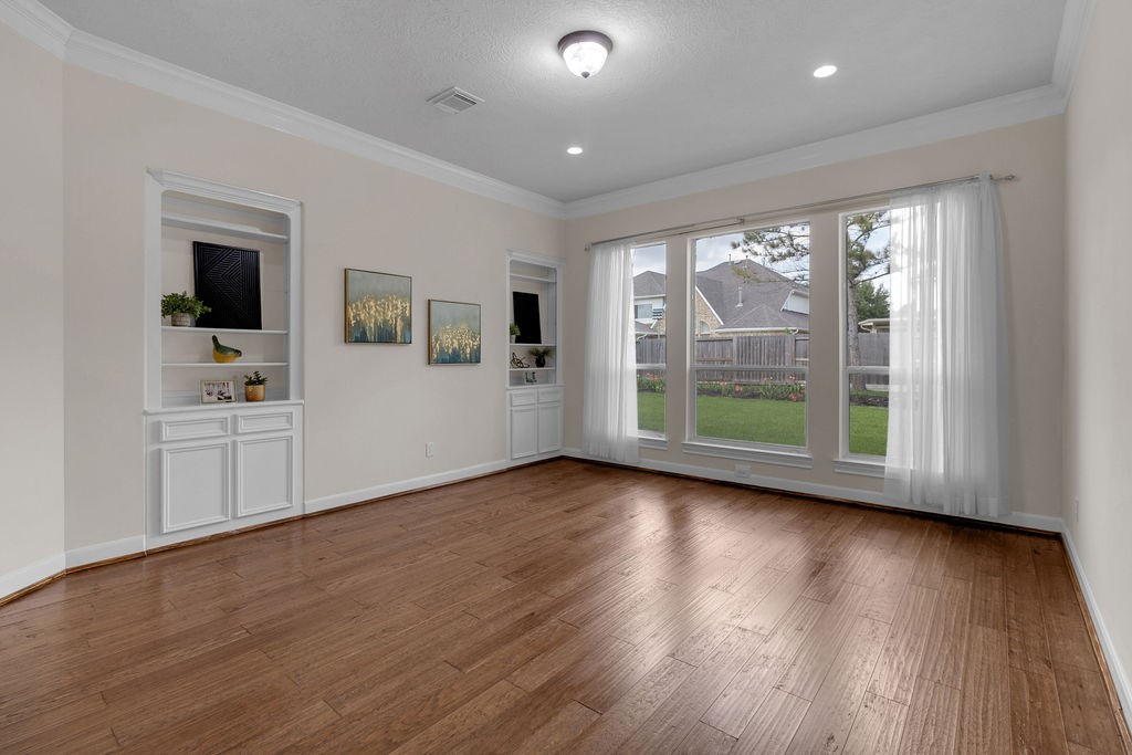 7306 Starflower Katy, TX 77494 - Photo 11 of 50 a view of a livingroom with hardwood floor and a window