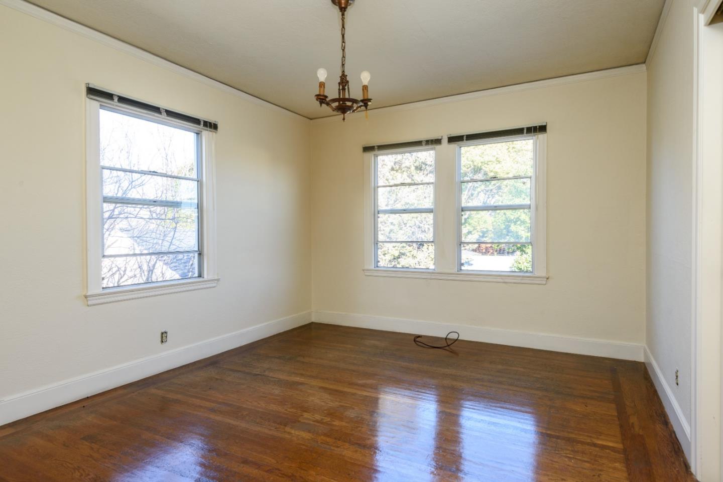 34 Dwight Road Burlingame, CA 94010 - Photo 11 of 13 a view of empty room with wooden floor and fan