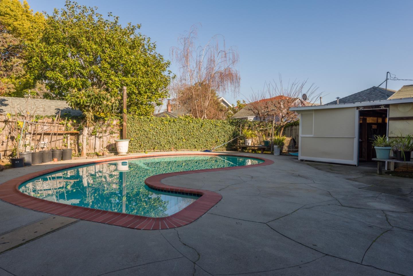 34 Dwight Road Burlingame, CA 94010 - Photo 12 of 13 a view of a swimming pool with a yard