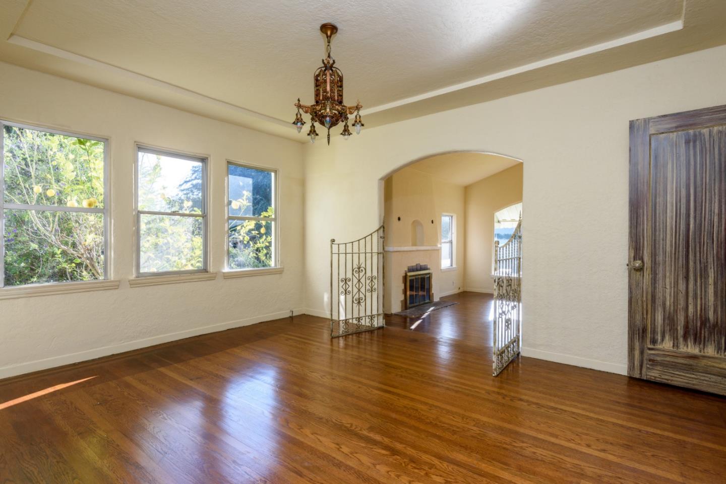 34 Dwight Road Burlingame, CA 94010 - Photo 3 of 13 a view of empty room with wooden floor and fan