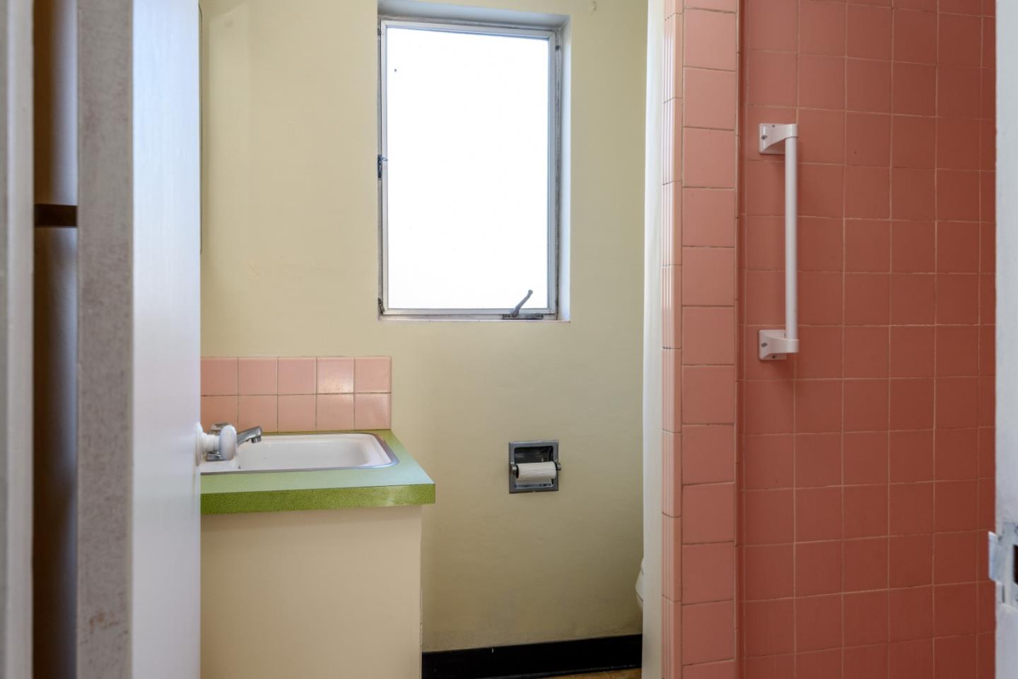 34 Dwight Road Burlingame, CA 94010 - Photo 7 of 13 a bathroom with a sink and a window