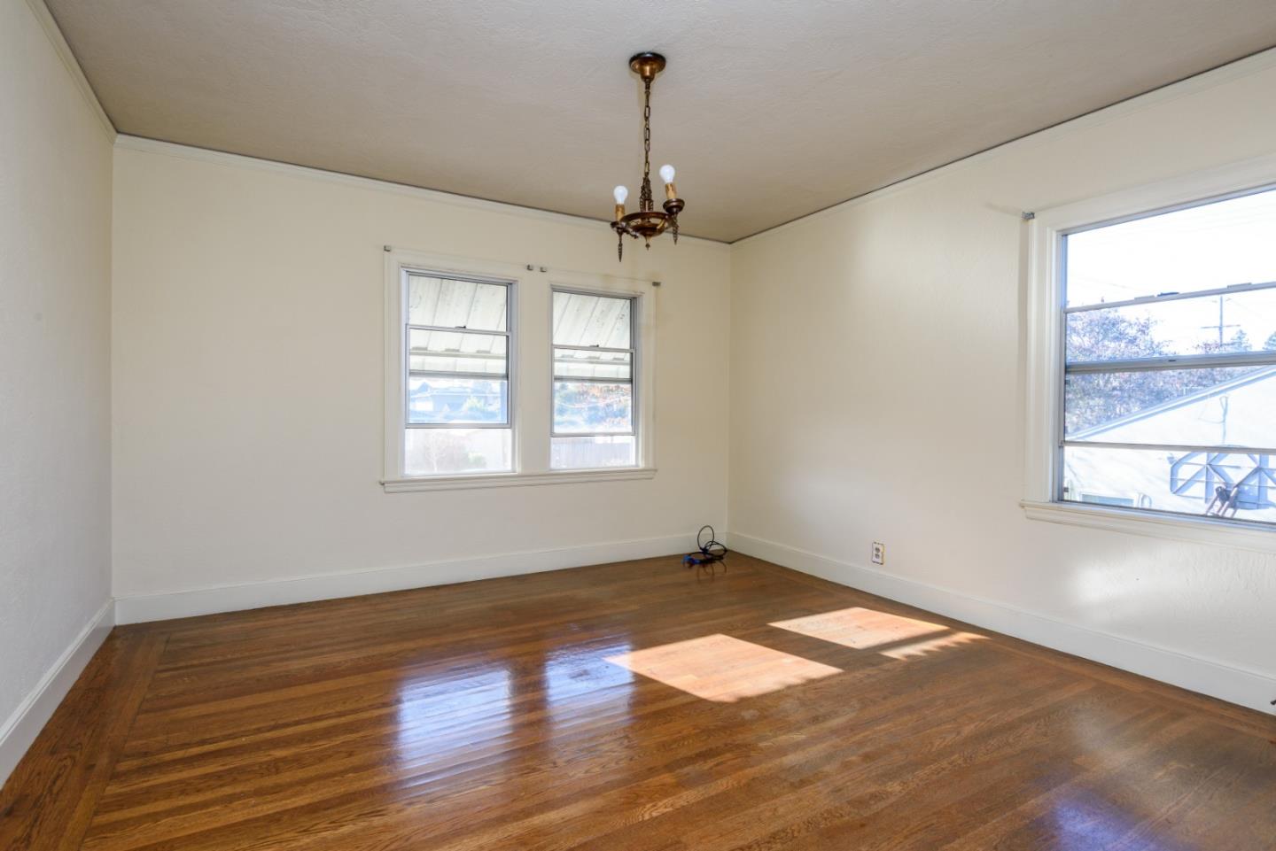 34 Dwight Road Burlingame, CA 94010 - Photo 8 of 13 wooden floor in an empty room with a window