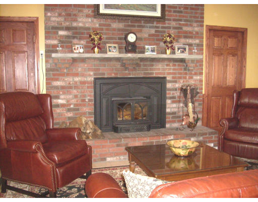 23 Deborah Road Hanover, MA 02339 - Photo 12 of 28 a living room with furniture and a fireplace