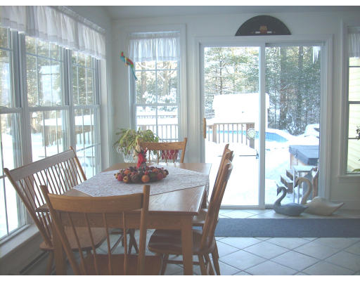 23 Deborah Road Hanover, MA 02339 - Photo 14 of 28 a dining room with furniture wooden floor and a potted plant