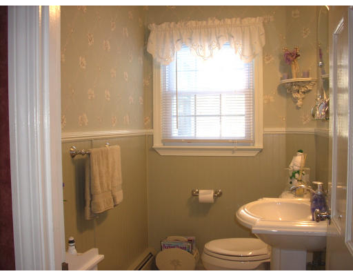 23 Deborah Road Hanover, MA 02339 - Photo 17 of 28 a bathroom with a toilet sink and mirror
