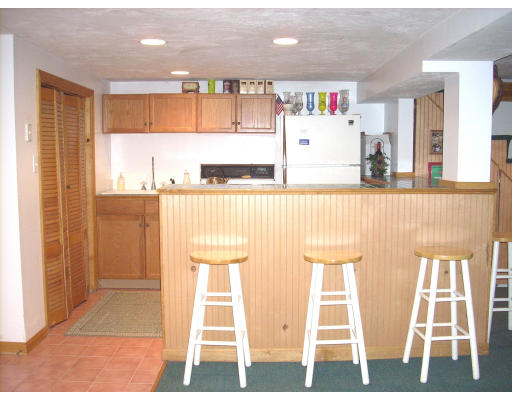 23 Deborah Road Hanover, MA 02339 - Photo 19 of 28 a kitchen with stainless steel appliances kitchen island granite countertop a refrigerator and a sink