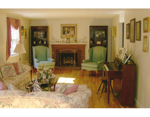 23 Deborah Road Hanover, MA 02339 - Photo 2 of 28 a living room with furniture and a fireplace
